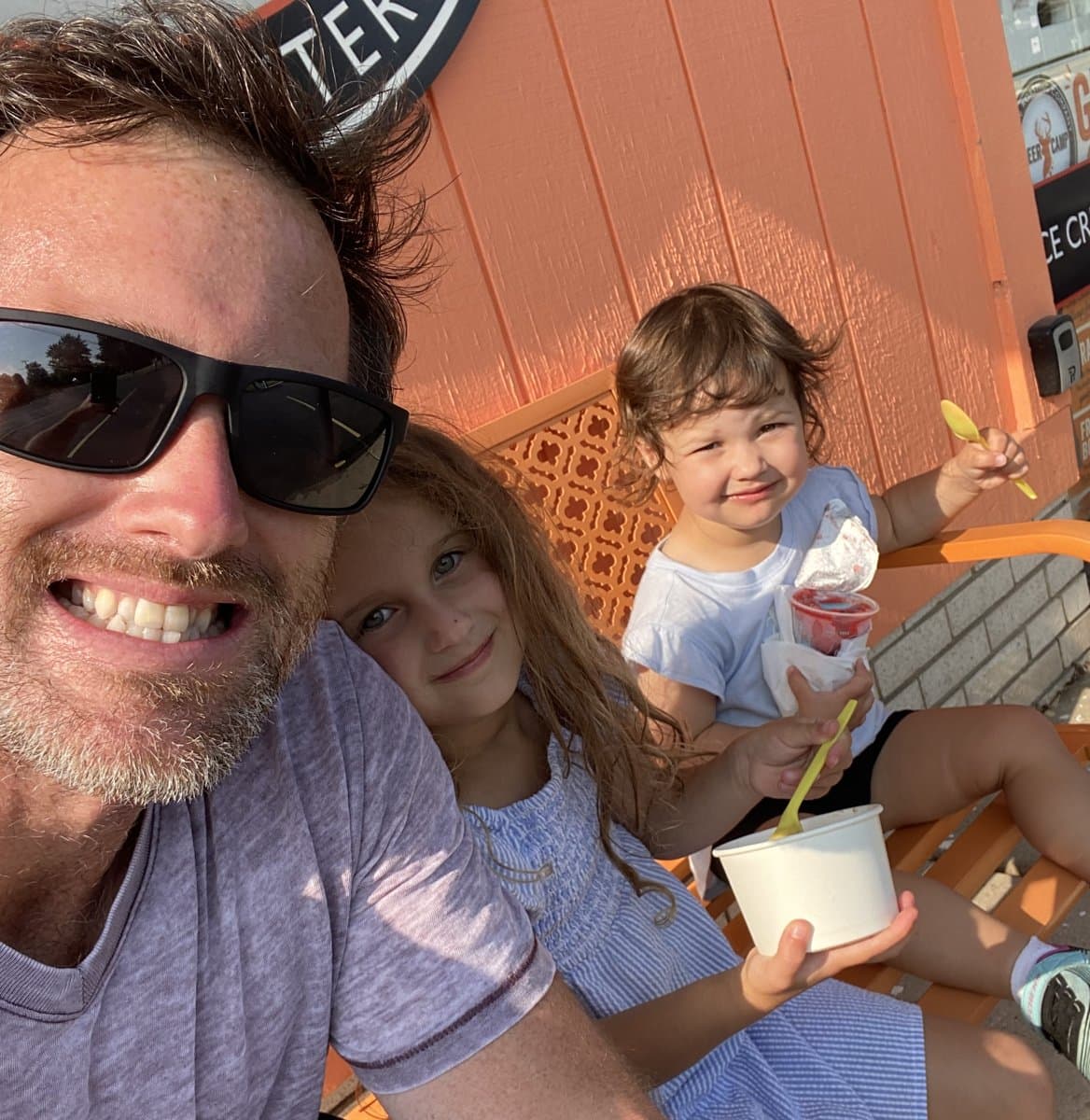 Ryan with his two daughters eating ice cream